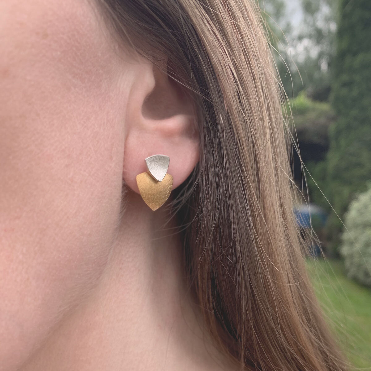 Kate Phipps Jewellery Trillion duo multiway stud earrings silver stud and 22 carat yellow gold plated silver lower section concave side model photo 1