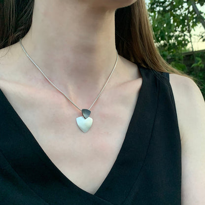 Kate Phipps Jewellery Trillion duo necklace oxidised silver top section and silver lower section convex side model photo 1