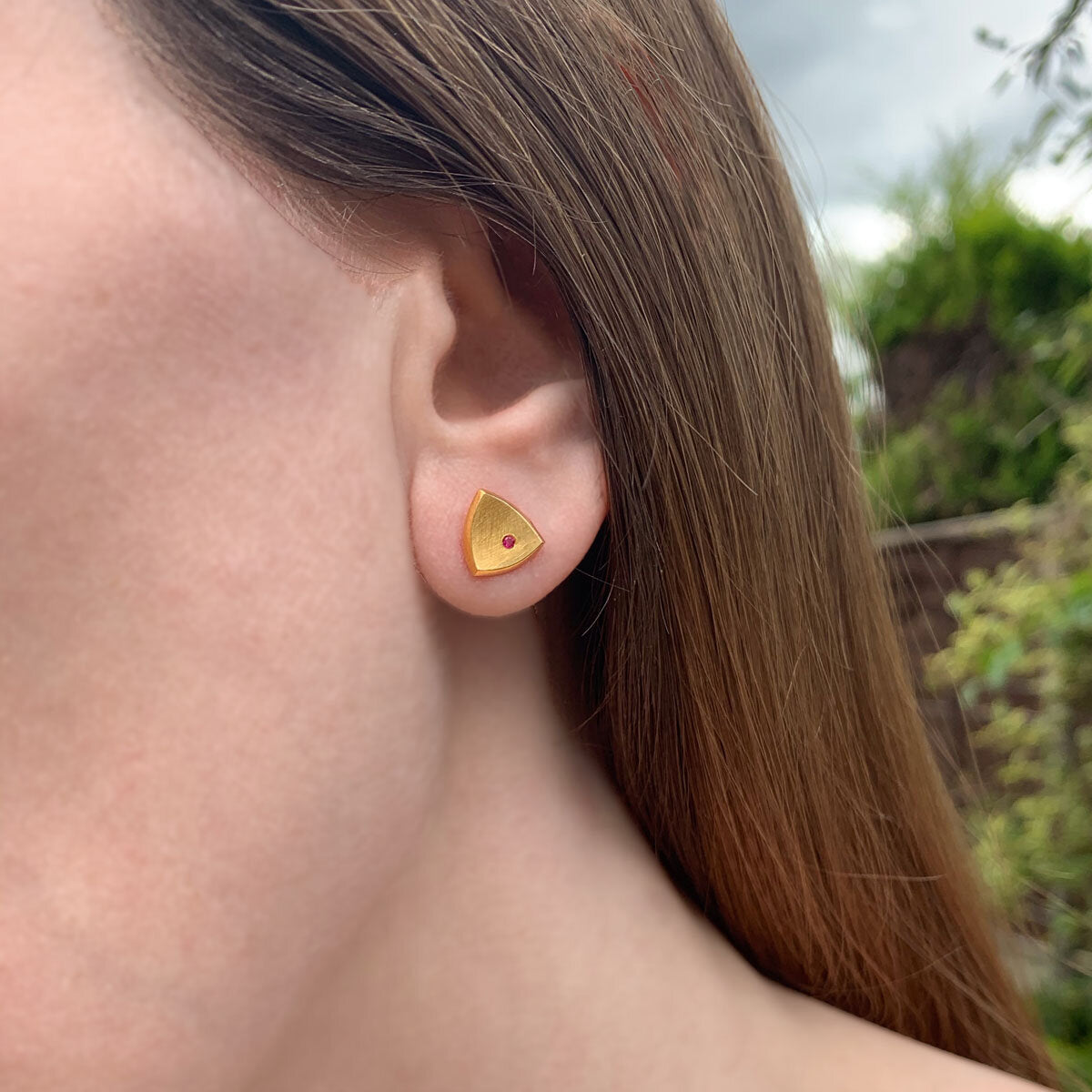 Kate Phipps Jewellery Trillion stud earrings medium 22 carat yellow gold plated silver with flush set ruby model photo