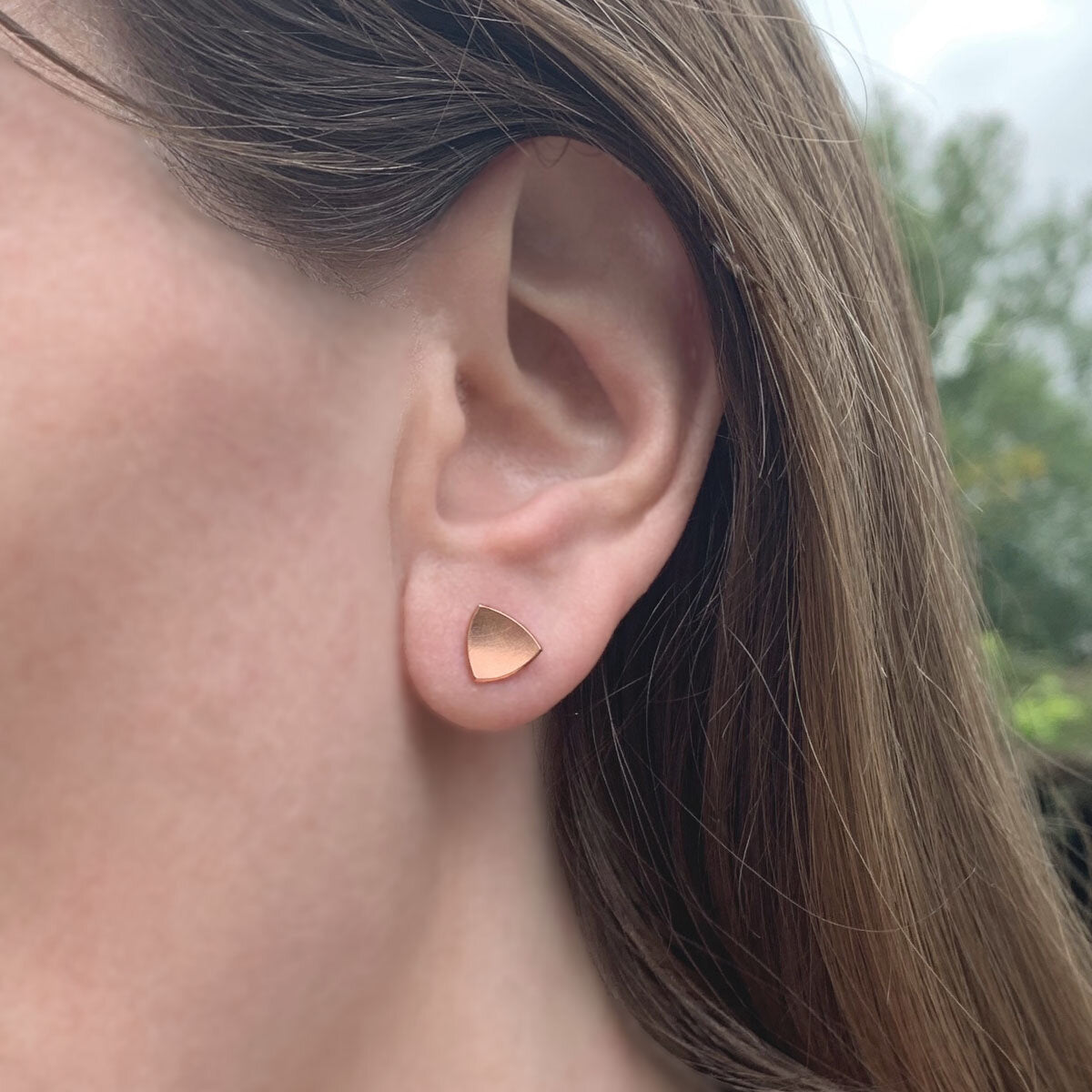 Kate Phipps Jewellery Trillion stud earrings small 18 carat rose gold plated silver model photo