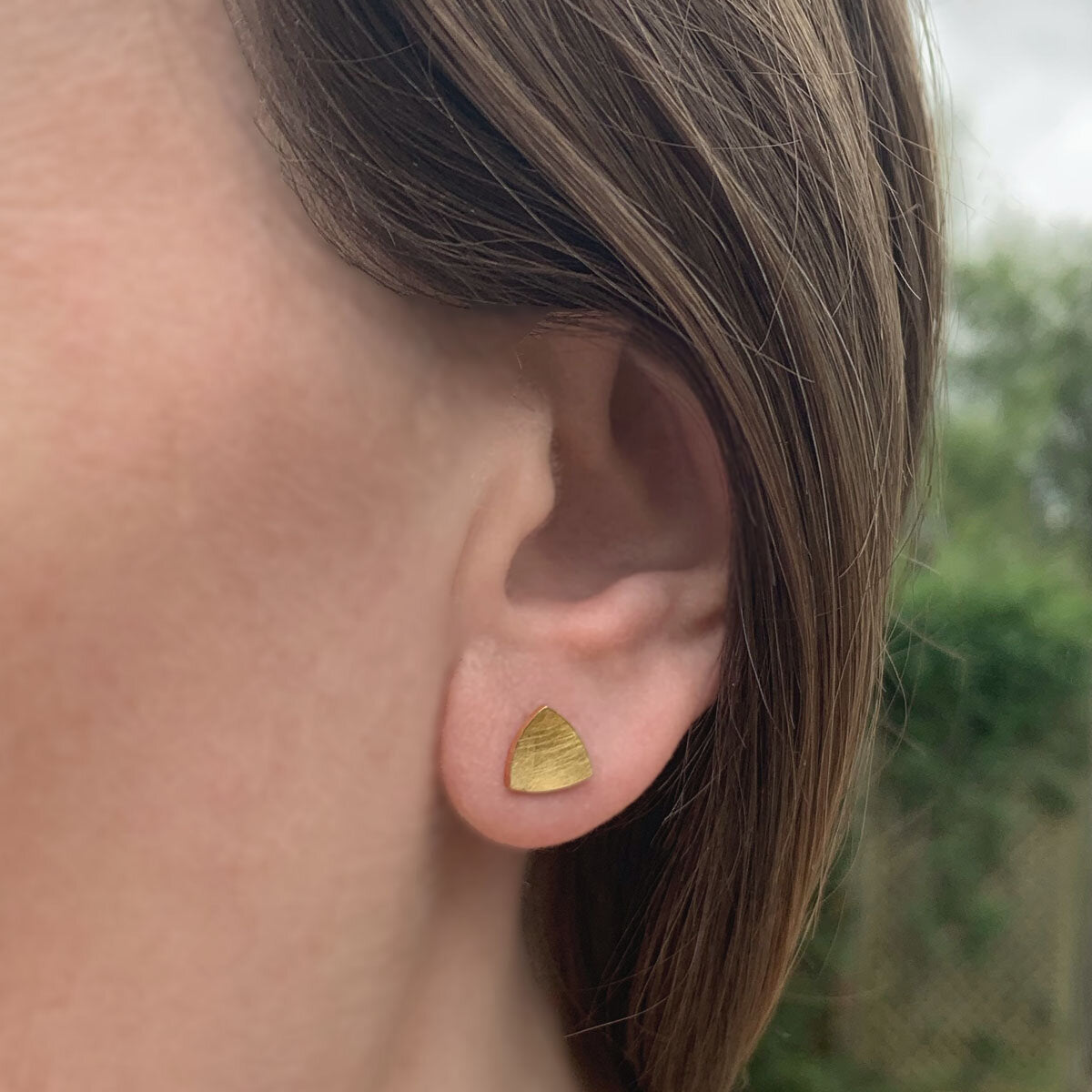 Kate Phipps Jewellery Trillion stud earrings small 22 carat yellow gold plated silver model photo